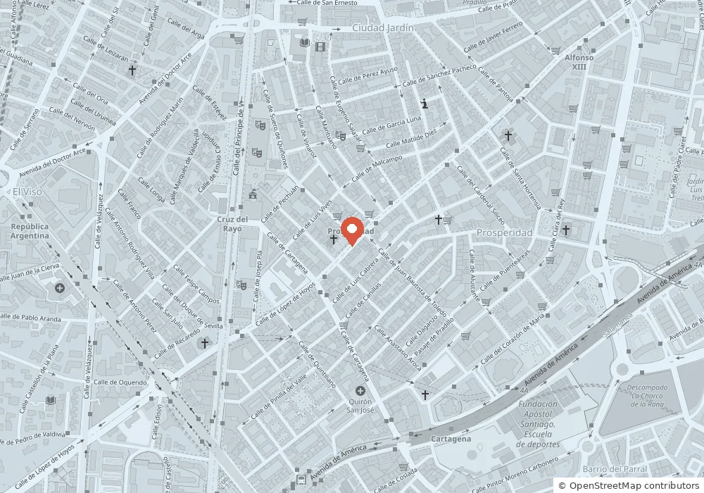 Mapa de un barrio residencial de Madrid con la clínica marcada en el centro, entre calles de manzanas cerradas.